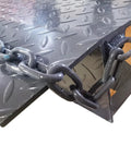 Close-up of Hardcore 59X79 Heavy Duty Dock Board And Container Ramp Built Like A Tank For 13228 Lb Loads showing anti-slip surface and chain.