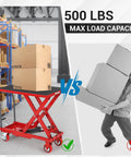 Front view of a red hydraulic lift table cart with a black non-slip top lifting a box in a warehouse, 500 lb capacity.