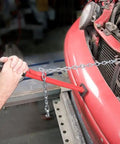 Man using Pogo II Pulling Stick Heavy Duty Auto Body Tool With Hook Bolt Heads And Flanges One Hand Operation For Quick Core Support Repairs on car bumper.