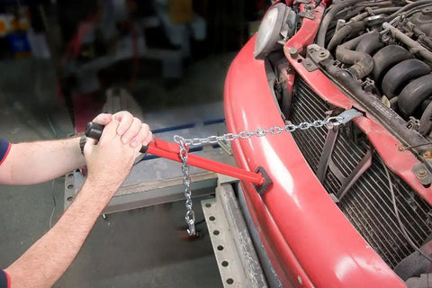 Man using Pogo II Pulling Stick Heavy Duty Auto Body Tool With Hook Bolt Heads And Flanges One Hand Operation For Quick Core Support Repairs on car bumper.