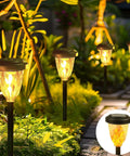 Pathway with lanterns illuminating at night, not directly showing Lit Outdoor String Lights 50ft S14 LED Bulbs Extendable Up To 250ft Waterproof IP65 Shatterproof Vintage Edison Style
