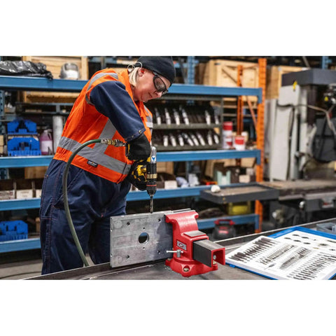 Person using Swivel Bench Vise Six Inch Opening With Three And A Half Inch Throat, 360 Degree Rotating Base With Lock Down in workshop