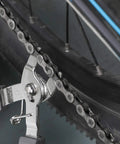 Pro Bike Chain Repair Kit With 2in1 Master Link Pliers And Chain Breaker Splitter For 6 To 10 Speed Chains Includes 6 Pairs Missing Links And Quick Links Professional Bicycle Tool Set Gray in use on a bicycle chain.