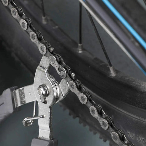 Pro Bike Chain Repair Kit With 2in1 Master Link Pliers And Chain Breaker Splitter For 6 To 10 Speed Chains Includes 6 Pairs Missing Links And Quick Links Professional Bicycle Tool Set Gray in use on a bicycle chain.