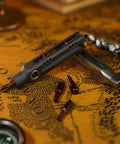 EDC Magnetic Mini Screwdriver Set With 10 S2 Steel Bits And Portable Aluminum Handle on a map background