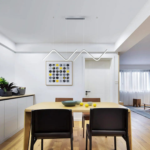 Slick Chrome LED Dimmable Linear Wave Pendant Lights For Kitchen Island And Dining Room Hanging 47.2 Inch Adjustable Chandelier Modern Minimalist Ceiling Fixture 40W illuminating a dining space.