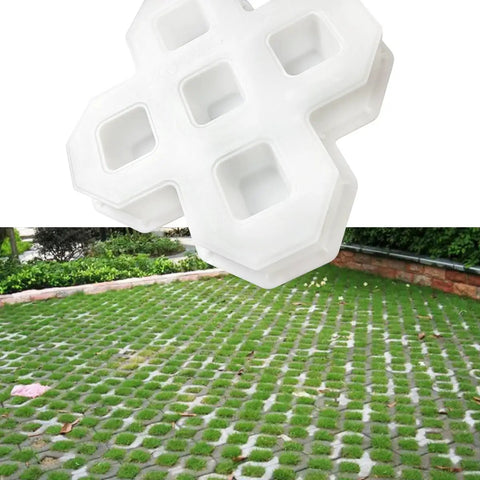 Reusable Plastic Grass Paver Molds With Five Hole Design For Concrete Pavers For Grass Driveways Walkways Parking And Landscaping Edging Made Of Durable ABS For DIY Friendly Reuse, shown in use on a grass driveway.