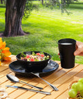 Camping Utensils Set For One Person, Portable Travel Silverware with Mug, Bowls, Plate, Stainless Steel Cutlery on picnic table