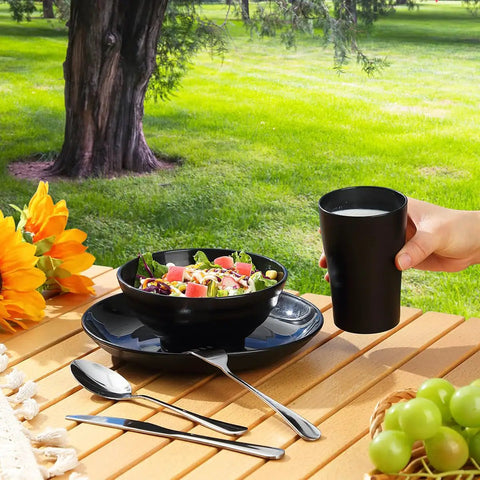 Camping Utensils Set For One Person, Portable Travel Silverware with Mug, Bowls, Plate, Stainless Steel Cutlery on picnic table