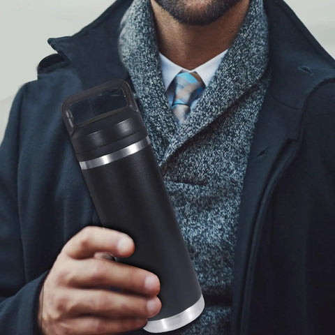 Man holding a black Rambler bottle with Screw Top Lid Replacement For Rambler Bottle 18 26 36 46 64 Oz No Spill Chug Cap Replacement Lids