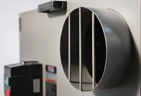Heavy Duty Portable Metalworking Dust Collector Crushing Sawdust Clutter At 957 CFM exhaust vent with metal grilles.