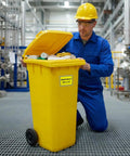Go To Emergency Spill Kit Label Decals Pack Of Ten Five By Three And A Half Inch Vinyl Self Adhesive Waterproof Safety Signs For Industrial Hazmat Areas Clear Kit Station Notices For Fast Response And Easy Spill Location on a yellow bin in an industrial setting