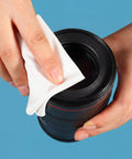 Pro Grade Cleanroom Microfiber Wipes 100 Pack, lint free cloth cleaning a camera lens with a 6x6 inch disposable lab wipe