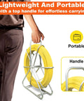 Person carrying Heavy Duty Pro Grade Fiberglass Duct Rodder Fish Tape 6mm x 500ft with durable steel stand
