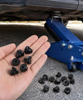 Hand holding 30 Pack Bottle Jack Rubber Plugs For 5 16 Inch Hole Flat Head Hydraulic Oil Filler Bung near a blue jack under a car.