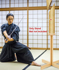 Practitioner with katana near 43 Inch Solid Pine Kendo Tameshigiri Practice Cutting Stand Real Deal Heavy Duty Wooden Dummy Holder