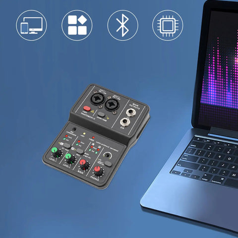 Two Channel DJ Mixer For Laptop Tablet And Phone With 16Bit 48KHz Audio Resolution Portable Pro Mixing Console next to laptop