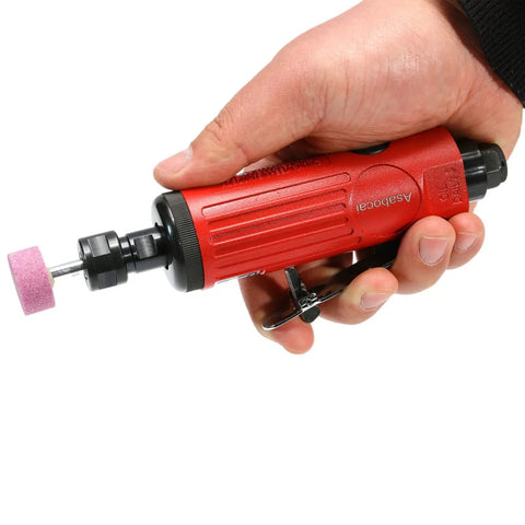 Shop Grade 1/4 Inch Pneumatic Straight Die Grinder With 22000 RPM Rapid Spin in hand with pink polishing bit attached.