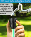 Hand holding a drip irrigation adapter connected to an outdoor faucet, part of the Drip Irrigation Pressure Regulator Kit.
