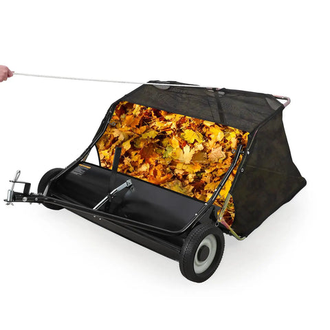 Heavy Duty Tow Behind Lawn Sweeper, 48 Inch Wide Sweep, 26 Cu Ft Debris Bag, Adjustable Height, Easy Dump Rope with leaves visible