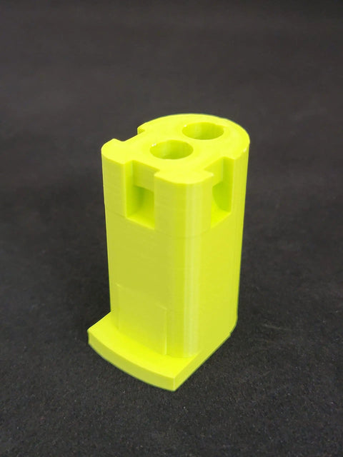 Single lime green battery bracket from the 18V Cordless Tool And Battery Mounts Set 12 Pack with Six Tool Mounts And Six Battery Brackets.