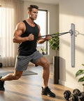 Man using Built Like A Tank Wall Mount Resistance Band Anchor Rack in home gym for full body workout.