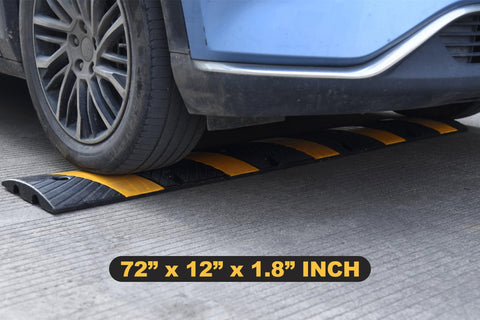 Car driving over Heavy Duty Rubber Speed Bump 6 Foot Ramp With Integrated Cable Cover 72 Inch Long One Piece Installation Kit