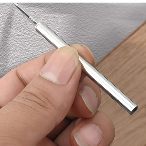 Hand holding pilot sleeve tool for Rock Solid Grip Smooth Sailing Install Kickass Carbon Steel Double Head Baseboard Screws.