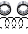 Wheel bearing kit: two metal bearings and five black rubber seals.