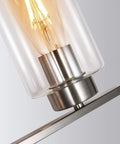 Close-up of clear glass shade and bulb on Three Light Brushed Nickel Luxe Bathroom Vanity Wall Sconce With Curved Modern Design