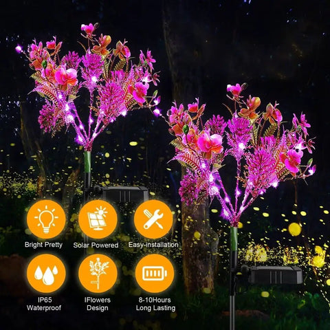 Outdoor Solar Flower Lights Set Phalaenopsis Orchid Solar Garden Lights Waterproof IP65 2 Pack glowing at night in garden