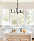 Modern 22 Inch 5 Light Candle Style Chandelier In Oil Rubbed Bronze Finish With Open Frame Design Ideal For Entryway Or Dining Room Sleek Hanging Fixture With Classic Uplight in a kitchen setting.