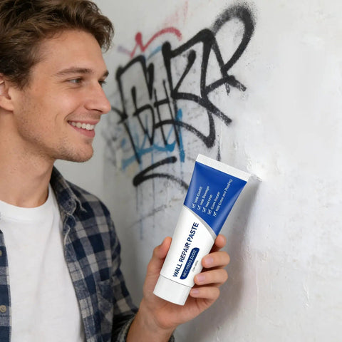 Person holding the Easy No Mess Drywall Hole Repair Paste Kit With Scraper For Quick Dry Putty Patching Of Cracks Gaps And Graffiti On Walls