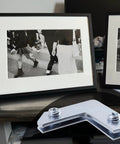 Rock Solid L Shaped Corner Brace Brackets 30 Pack 35x13mm Picture Frame Supports for securing framed photos on a table.