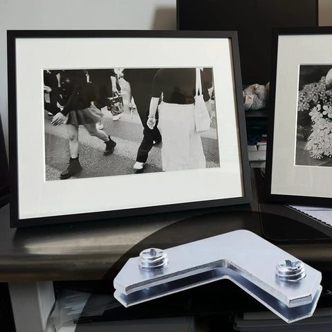 Rock Solid L Shaped Corner Brace Brackets 30 Pack 35x13mm Picture Frame Supports for securing framed photos on a table.