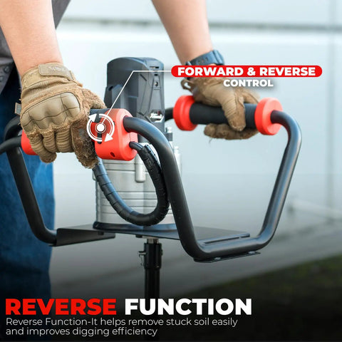 Gloved hands operating Powerful 1500W Electric Post Hole Digger Earth Auger with reverse function controls visible.