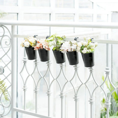 5 Pack 4 Inch Hanging Flower Pots Metal Dope Planters For Railing Fence Balcony And Garden Outdoor Decor With Detachable Hooks Ideal For Herb And Flower Gardens In Black displayed on a white fence.