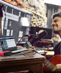 Musician recording with 2x2 USB Audio Interface With Mic Preamplifier And 48V Phantom Power For Studio Quality Recording And 24 Bit Resolution