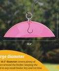 Clear Dome Bird Feeder Rain Guard Ten And A Half Inch Weather Shield shown hanging with hook, pink dome, 10.5 inch diameter.