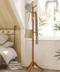 Solid Wood Coat Rack With Ten Hooks Free Standing Hall Tree in bedroom with hats and bags, caramel brown finish, stable tri leg base