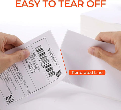Hands tearing 4x6 thermal direct shipping labels with perforated line, pack of 500, fanfold commercial grade for easy shipping and fulfillment.