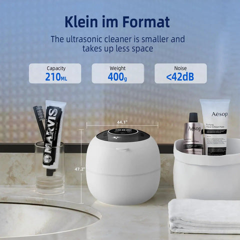 Cordless Ultrasonic Retainer Cleaner With 48kHz Vibration, 210ml Tank, shown on bathroom counter next to toiletries.