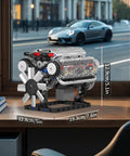 Dope V8 Engine Building Blocks Set With Battery Box And Motor, realistic model on a desk by a window, 535 pieces