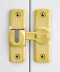90 And 180 Degree Adjustable Barn Door Lock For Privacy And Security, Easy Install Sliding Door Latch in brass on white door