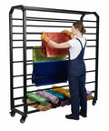 Heavy Duty Commercial Fabric Roll Storage Rack With 16 Adjustable Hanging Rods For Superior Cloth Organization, filled with colorful fabrics.