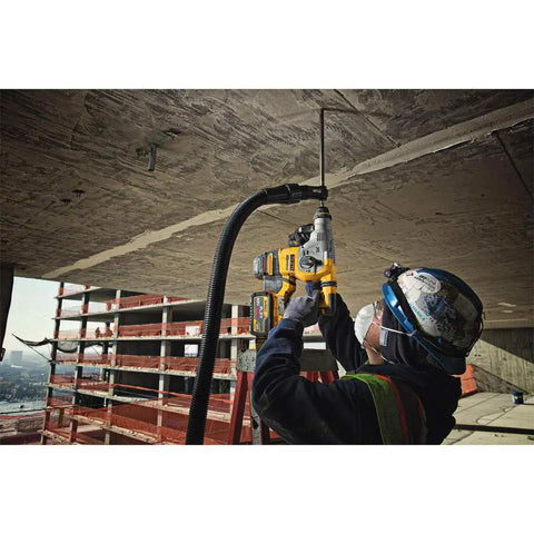 Worker using a Heavy Duty Cordless 20V Brushless Rotary Hammer Drill Sick Power Bad Boy for concrete drilling overhead on-site.