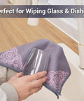 YUA microfiber cleaning cloth, gray with pink floral pattern, front view wiping a glass