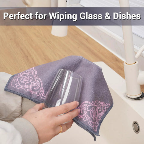 YUA microfiber cleaning cloth, gray with pink floral pattern, front view wiping a glass
