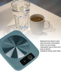 Smart Coffee Mug Warmer Keeps Your Morning Brew Cozy At Steady 131 Degrees With Usb Powered Thermal Control Solid Choice For Desk Office Or Car Setup Coffee Enthusiasts Stoked On Consistent Heat In Green on a table with a cup of coffee and water.