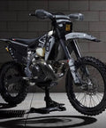 Side view of bike on Beefy Heavy Duty Lift Stand For Dirt Bikes And Mini Riders 500 Lb Capacity Carbon Steel Construction Lightweight Yet Durable